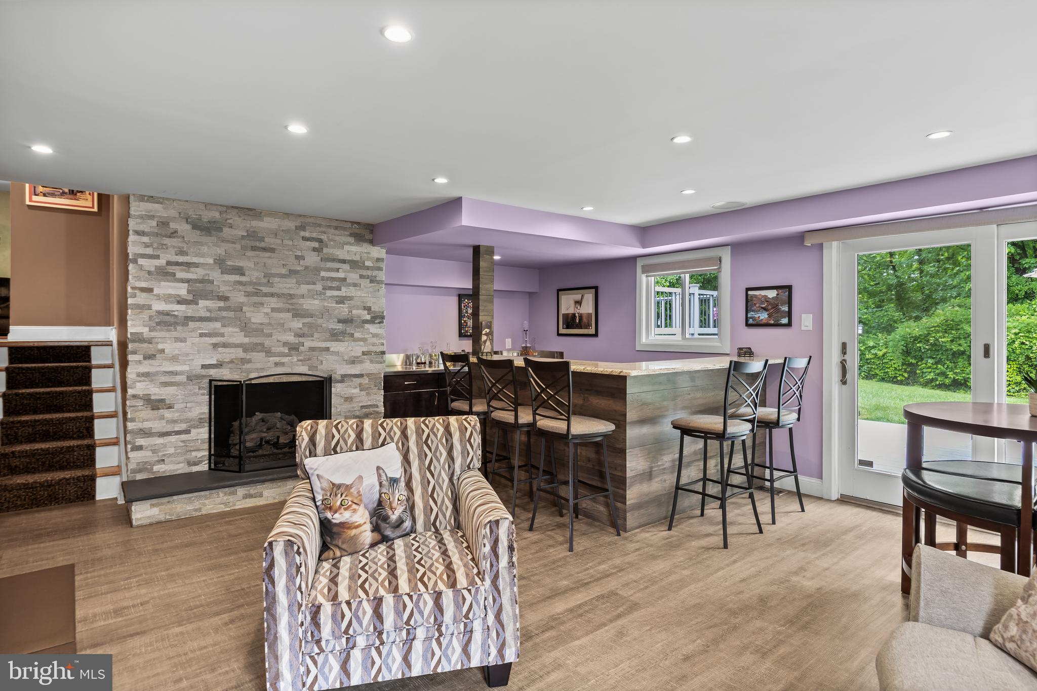 47 Clemson Road Cherry Hill, NJ 08034 - Photo 3 of 50 a living room with furniture a fireplace and a floor to ceiling window