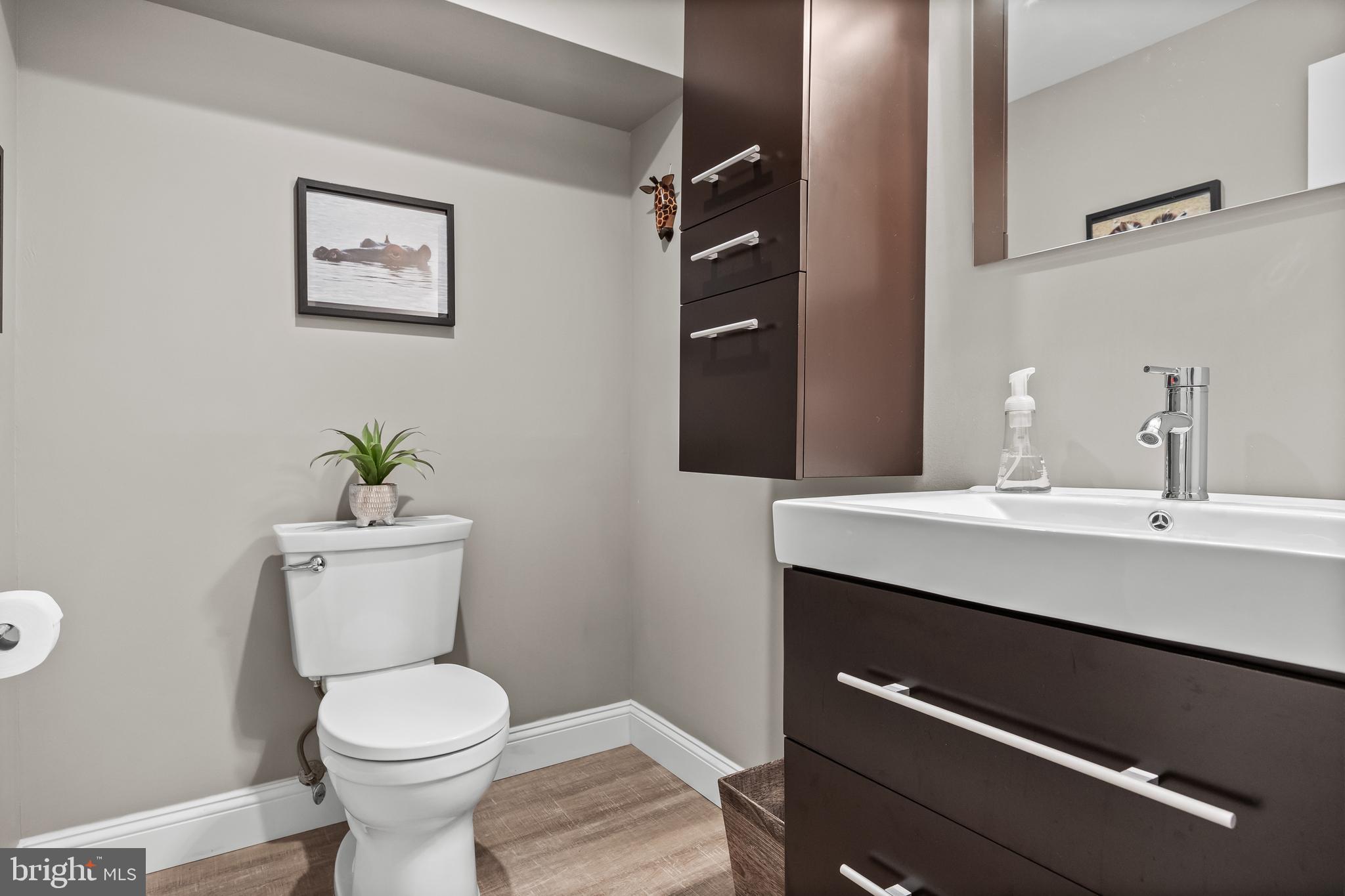 47 Clemson Road Cherry Hill, NJ 08034 - Photo 33 of 50 a bathroom with a toilet a sink and mirror