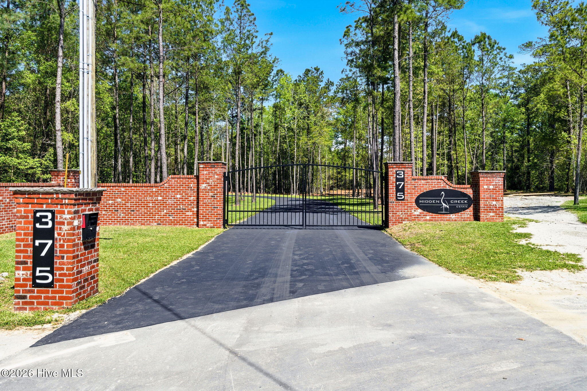 383 Wolfridge Road Northeast Leland, NC 28451 - Photo 3 of 24 Gated Entrance