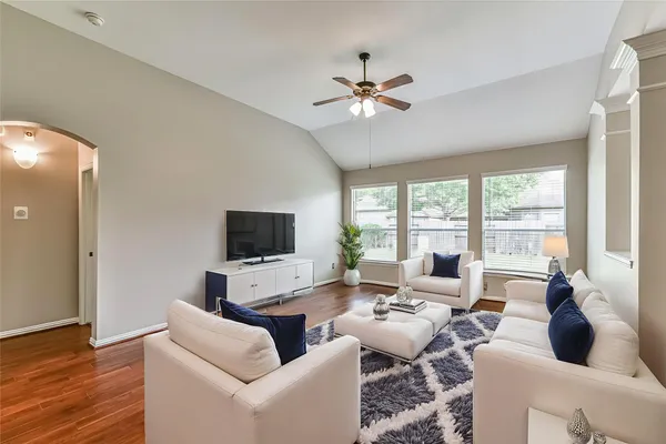 a living room with furniture and a flat screen tv