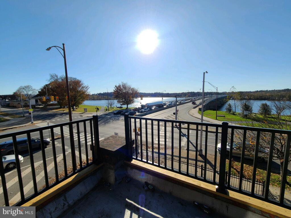 901 North Front Street, Unit 3R Harrisburg, PA 17102 - Photo 11 of 21 a roof deck with table and chairs
