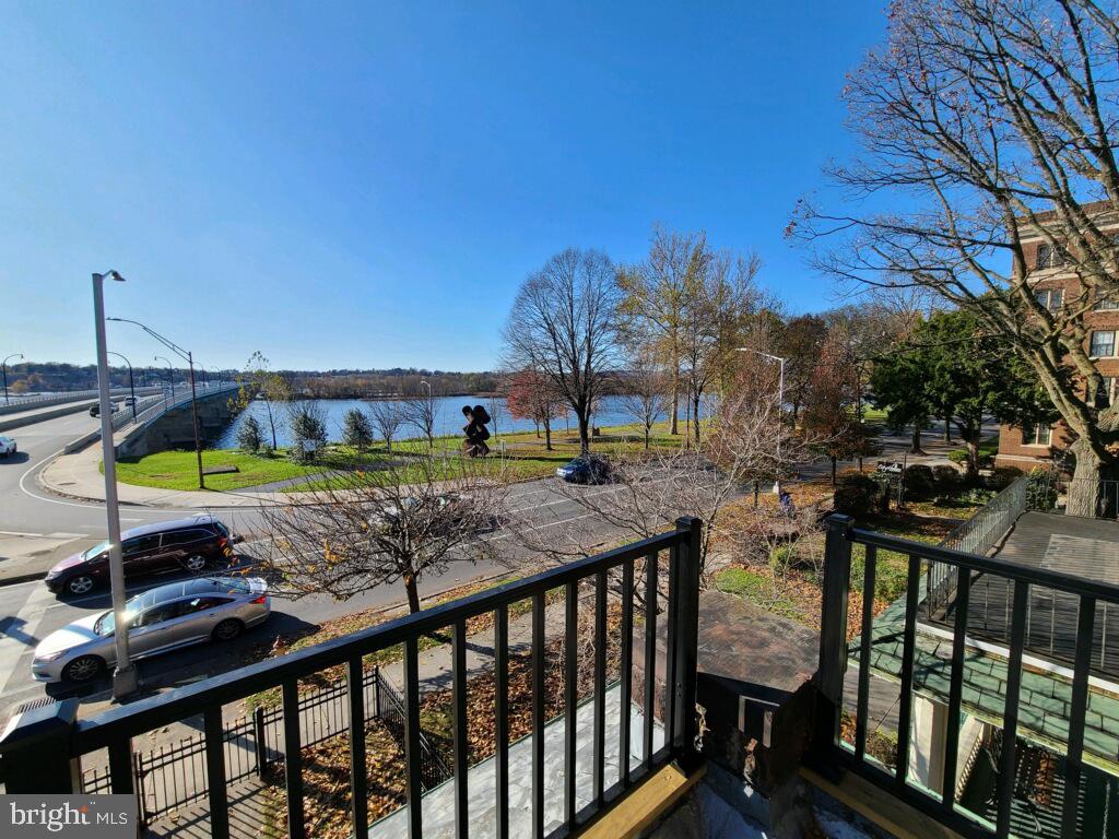 901 North Front Street, Unit 3R Harrisburg, PA 17102 - Photo 14 of 21 a view of a roof deck with table and chairs under an umbrella
