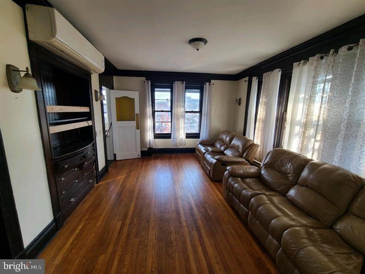 901 North Front Street, Unit 3R Harrisburg, PA 17102 - Photo 3 of 21 a living room with furniture and a hard wood floor