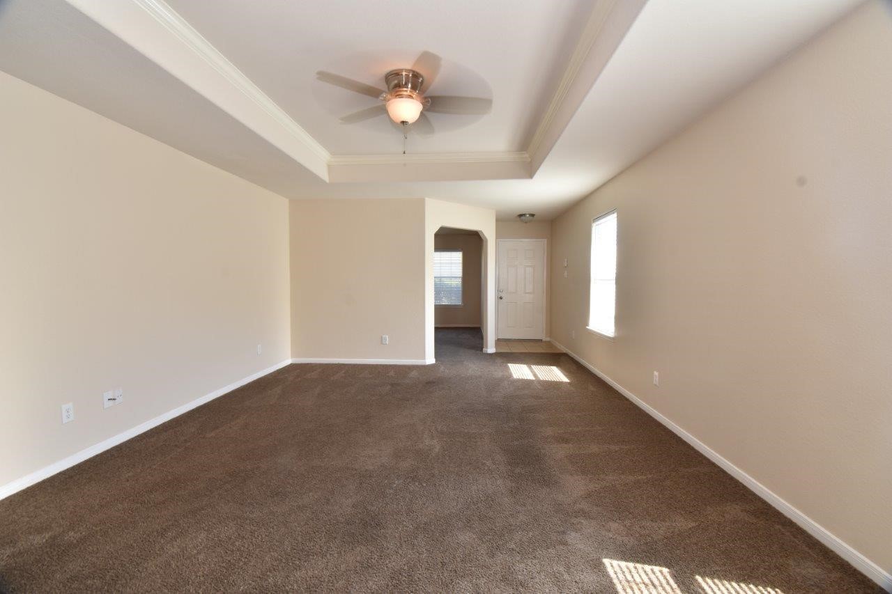 1126 Desert Oasis Lane Rosenberg, TX 77471 - Photo 4 of 16 a view of an empty room with a window