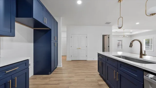 a kitchen with a sink and cabinets