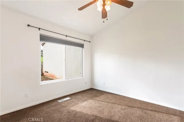 a bathroom with a granite countertop sink toilet a mirror and shower