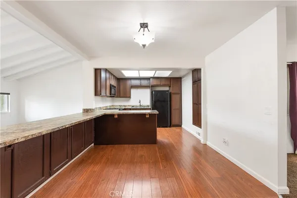 a kitchen with a refrigerator stove and microwave