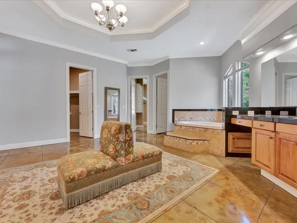 a view of a livingroom with furniture and a large window