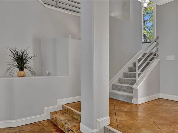 a view of entryway with wooden floor