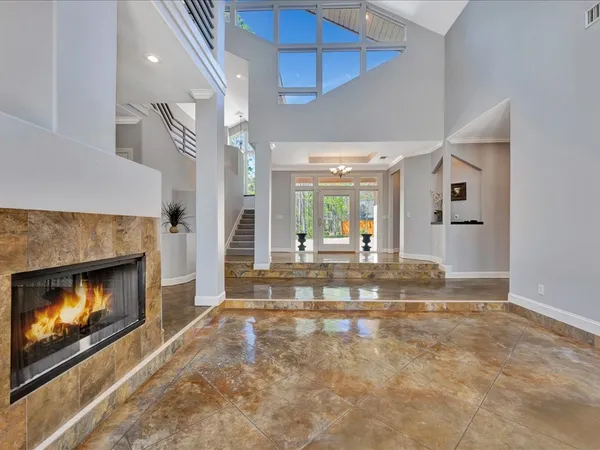 a view of an empty room and fire place