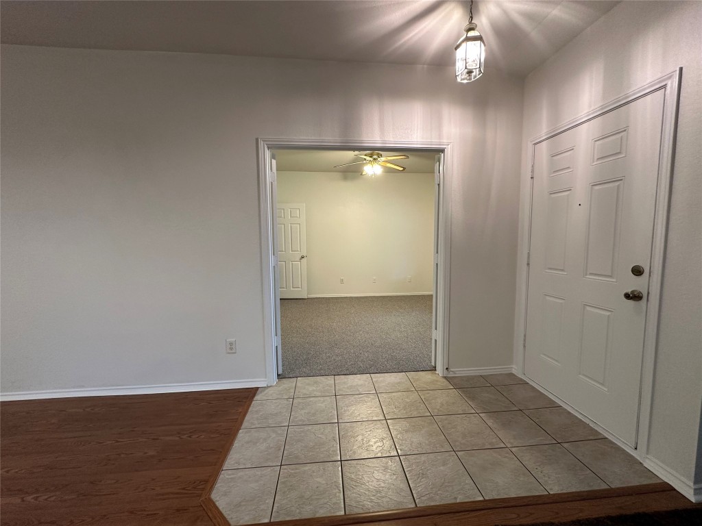 3412 Napa Valley Bend Leander, TX 78641 - Photo 2 of 27 Tiled foyer entrance featuring baseboards and a ceiling fan