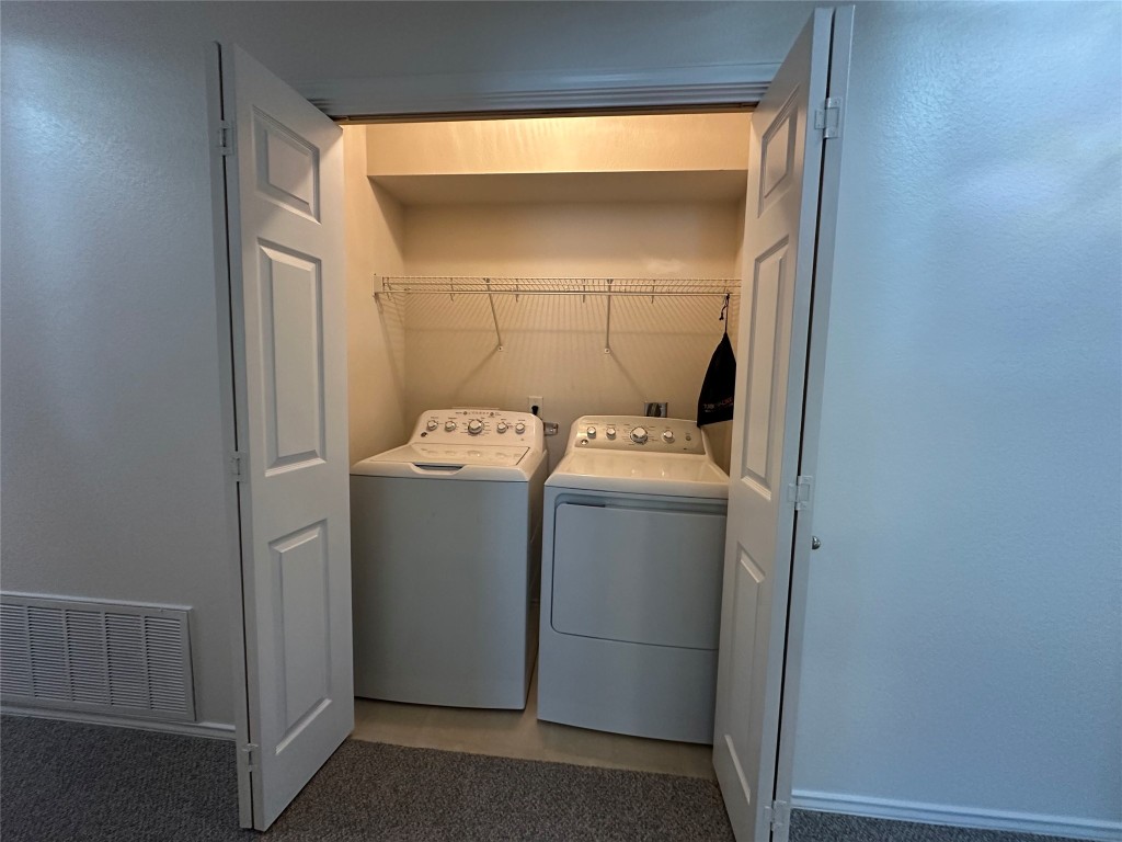 3412 Napa Valley Bend Leander, TX 78641 - Photo 25 of 27 Washroom with independent washer and dryer and light carpet