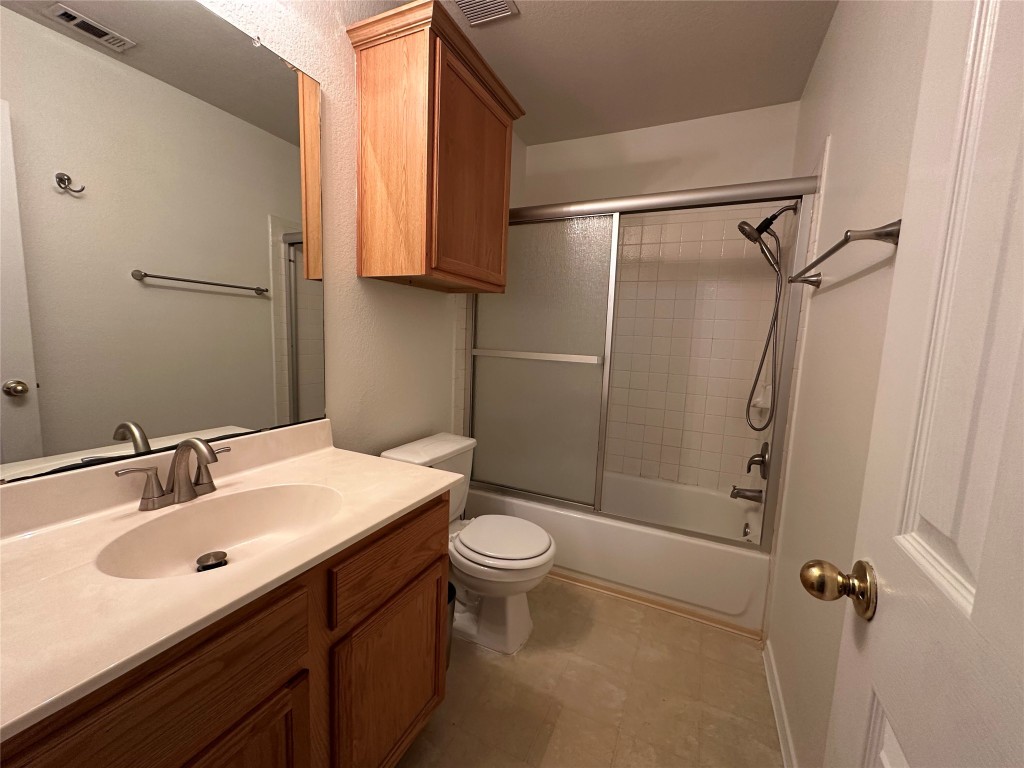 3412 Napa Valley Bend Leander, TX 78641 - Photo 5 of 27 Full bath with bath / shower combo with glass door and vanity
