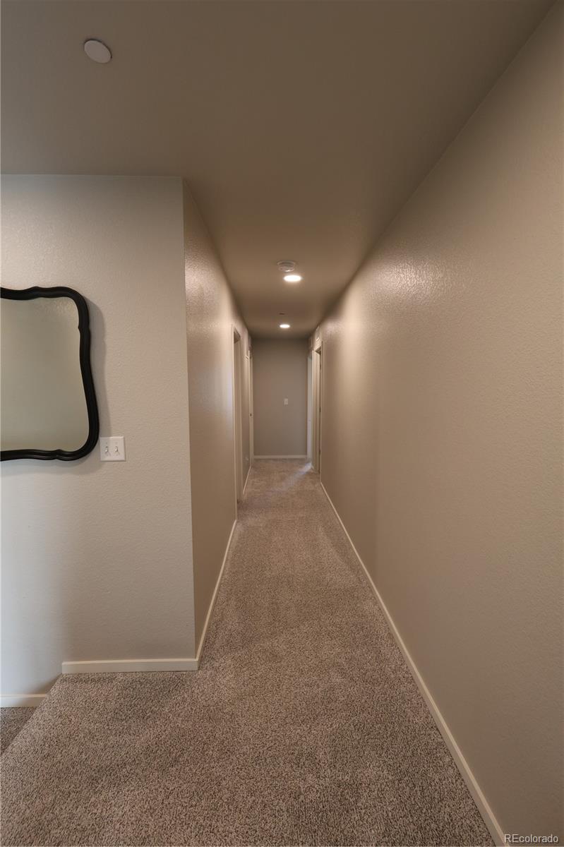 6719 4th St Road, Unit 2 Greeley, CO 80634 - Photo 11 of 23 a view of hallway with stairs