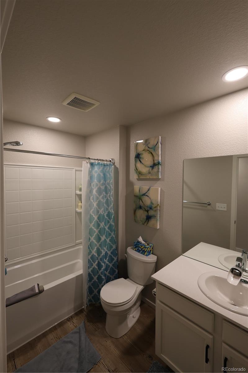 6719 4th St Road, Unit 2 Greeley, CO 80634 - Photo 19 of 23 a bathroom with a sink a toilet and shower