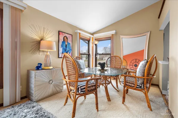 a kitchen with stainless steel appliances granite countertop a stove a sink dishwasher and cabinets with wooden floor