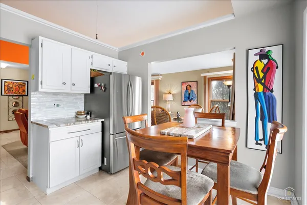 a kitchen with white cabinets stainless steel appliances and sink