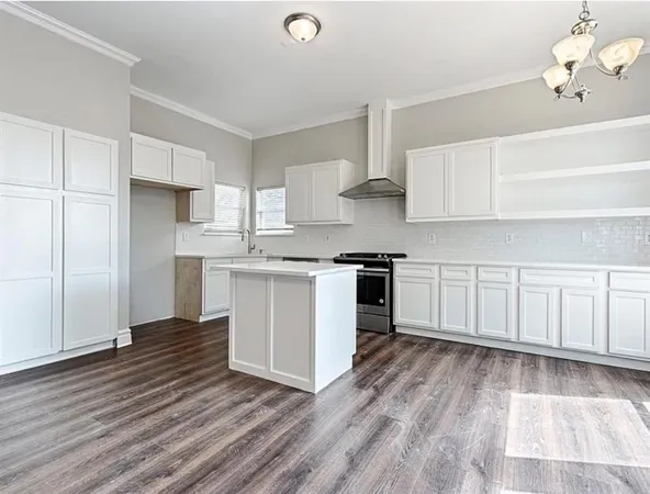 a view of a kitchen with wooden floor