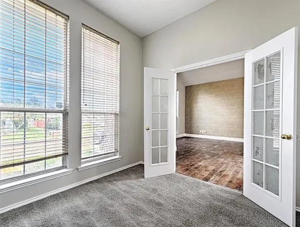 a spacious bathroom with a double vanity sink mirror and toilet