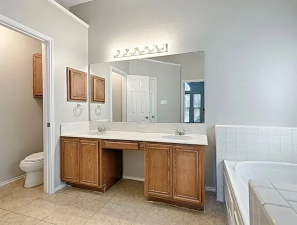 a bathroom with a bathtub and a sink