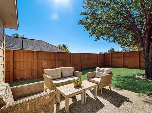 a view of a yard with a tree