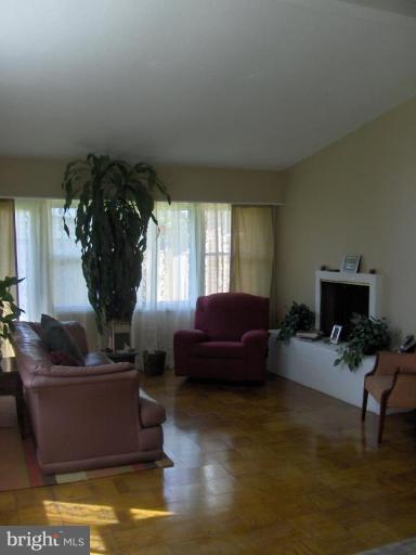 601 Kerwin Road Silver Spring, MD 20901 - Photo 11 of 13 a living room with furniture window and a fireplace