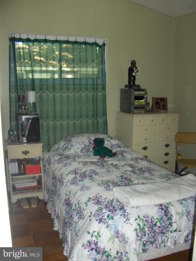 601 Kerwin Road Silver Spring, MD 20901 - Photo 12 of 13 a bedroom with a bed and a window