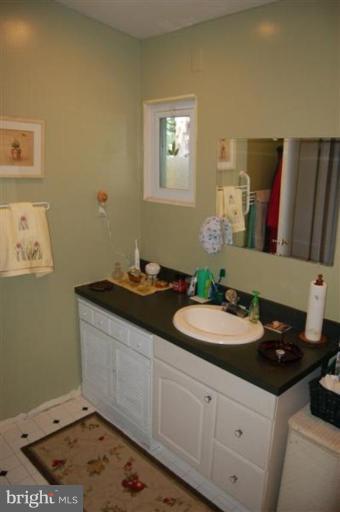 601 Kerwin Road Silver Spring, MD 20901 - Photo 3 of 13 a bathroom with a sink and a mirror