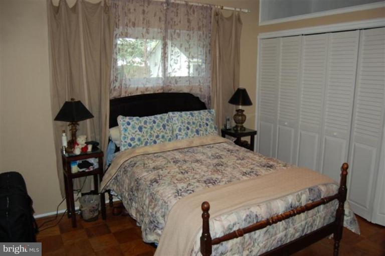 601 Kerwin Road Silver Spring, MD 20901 - Photo 4 of 13 a bedroom with a bed and a window