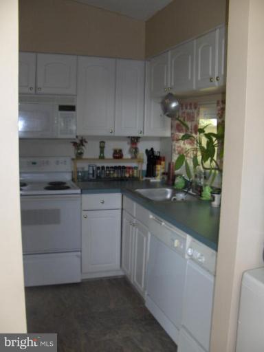 601 Kerwin Road Silver Spring, MD 20901 - Photo 9 of 13 a kitchen with a sink and cabinets