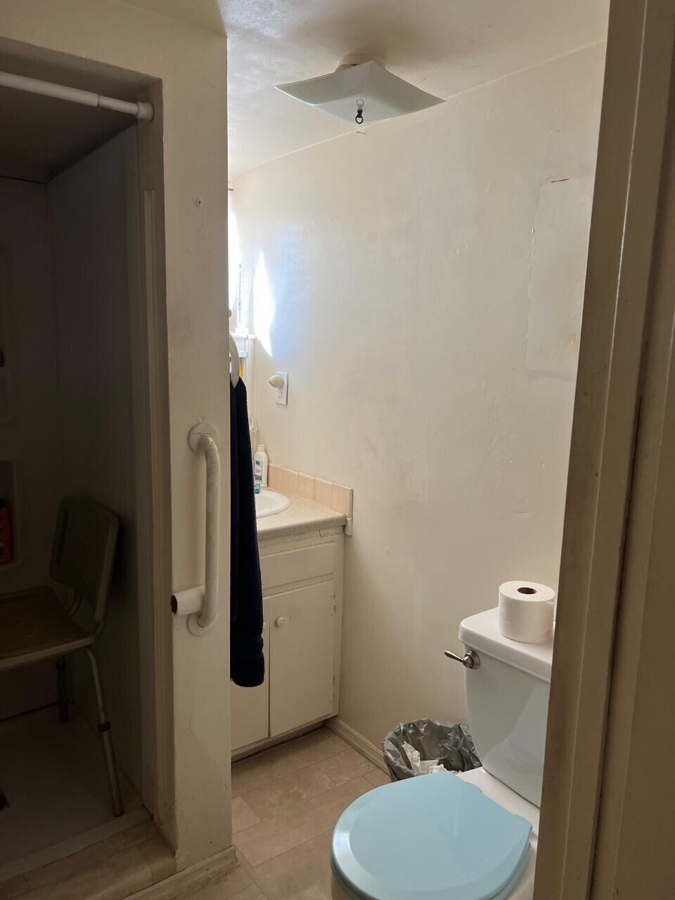 6764 Airport Road Redding, CA 96002 - Photo 22 of 22 a bathroom with a toilet and a mirror