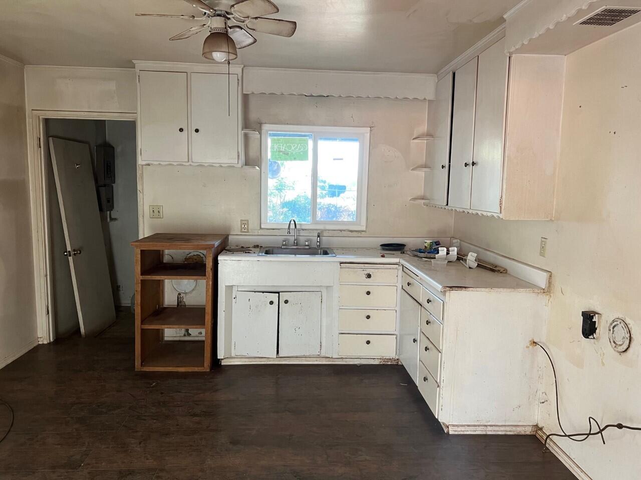 6764 Airport Road Redding, CA 96002 - Photo 6 of 22 a utility room with cabinets washer and dryer