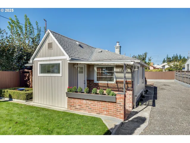 a front view of a house with garden