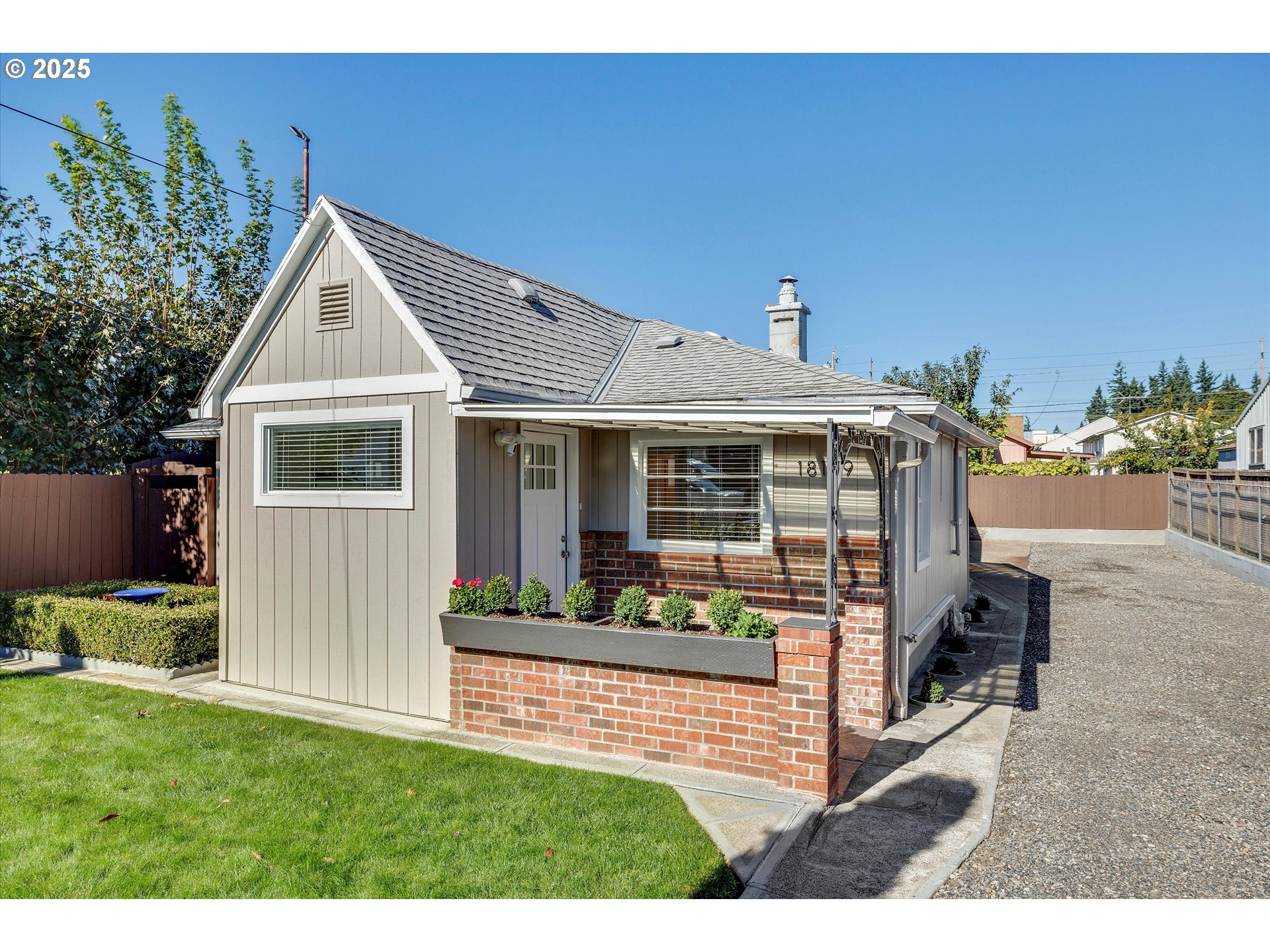 18149 Southeast Pine Street Portland, OR 97233 - Photo 1 of 36 a front view of a house with garden