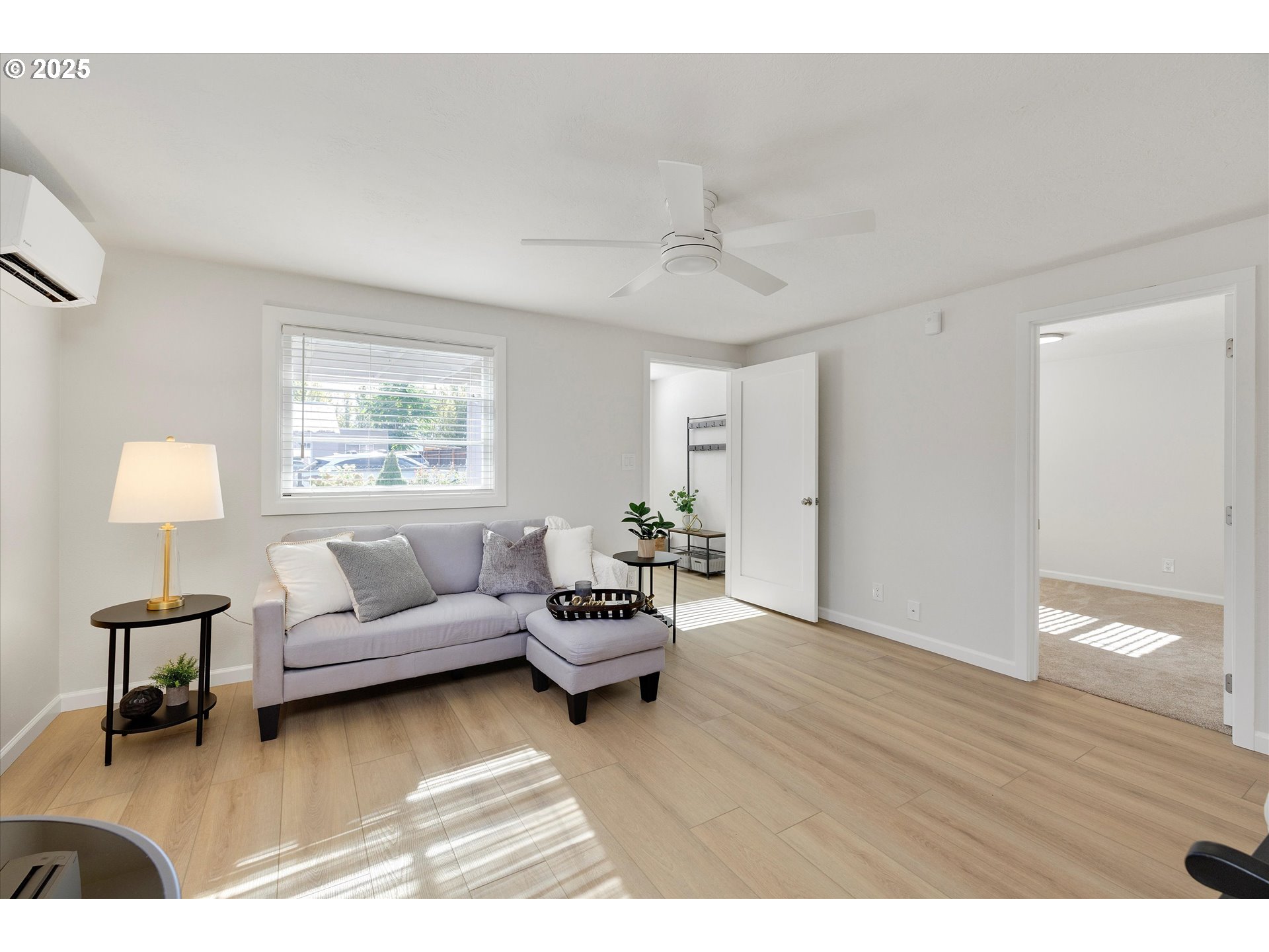 18149 Southeast Pine Street Portland, OR 97233 - Photo 12 of 36 a living room with furniture and a wooden floor