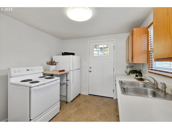 a kitchen that has a sink and a stove