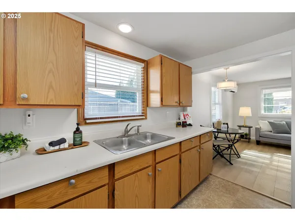 a kitchen with a sink and cabinets