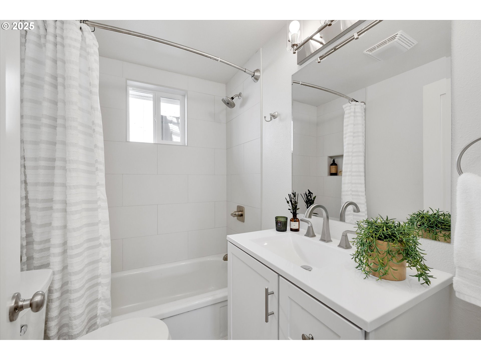 18149 Southeast Pine Street Portland, OR 97233 - Photo 20 of 36 a bathroom with a sink vanity granite tub shower and a mirror