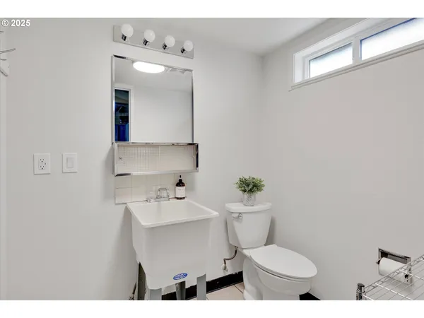 a picture of a bench in front of a wall