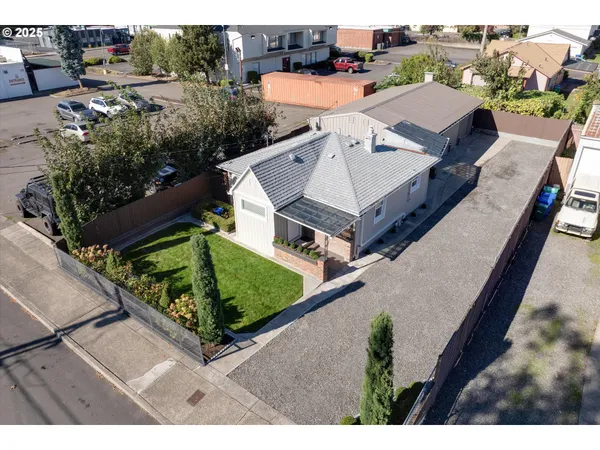 an aerial view of a house with a garden