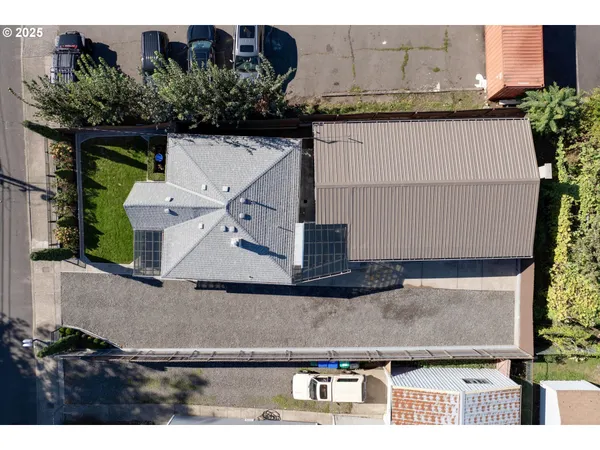 an aerial view of residential houses with outdoor space