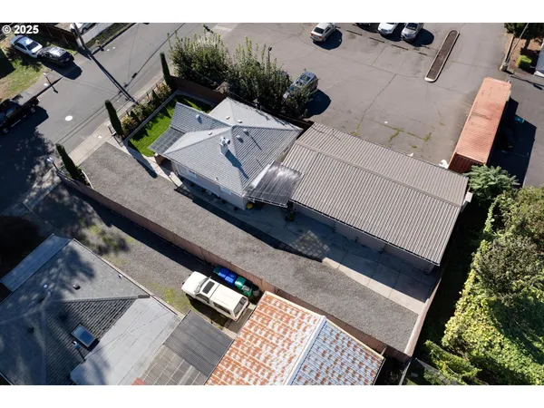 an aerial view of a house with outdoor space
