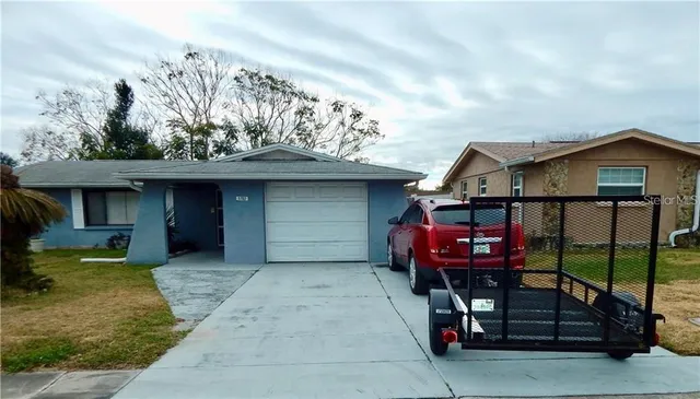a view of a house with a balcony and sitting area