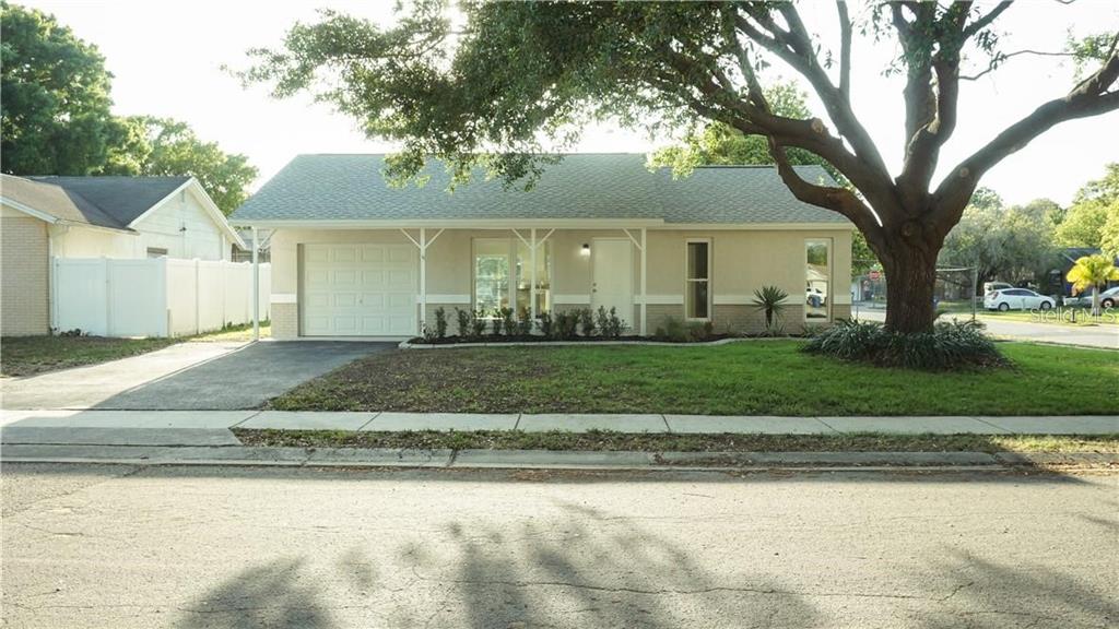 3409 Vidal Street New Port Richey, FL 34655 - Photo 1 of 8 a front view of a house with a yard