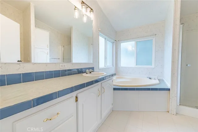 a view of a field with trees in background