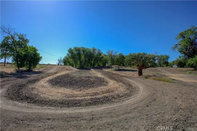 a view of a yard with an outdoor seating
