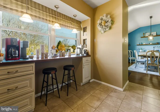 a kitchen with a table and chairs in it