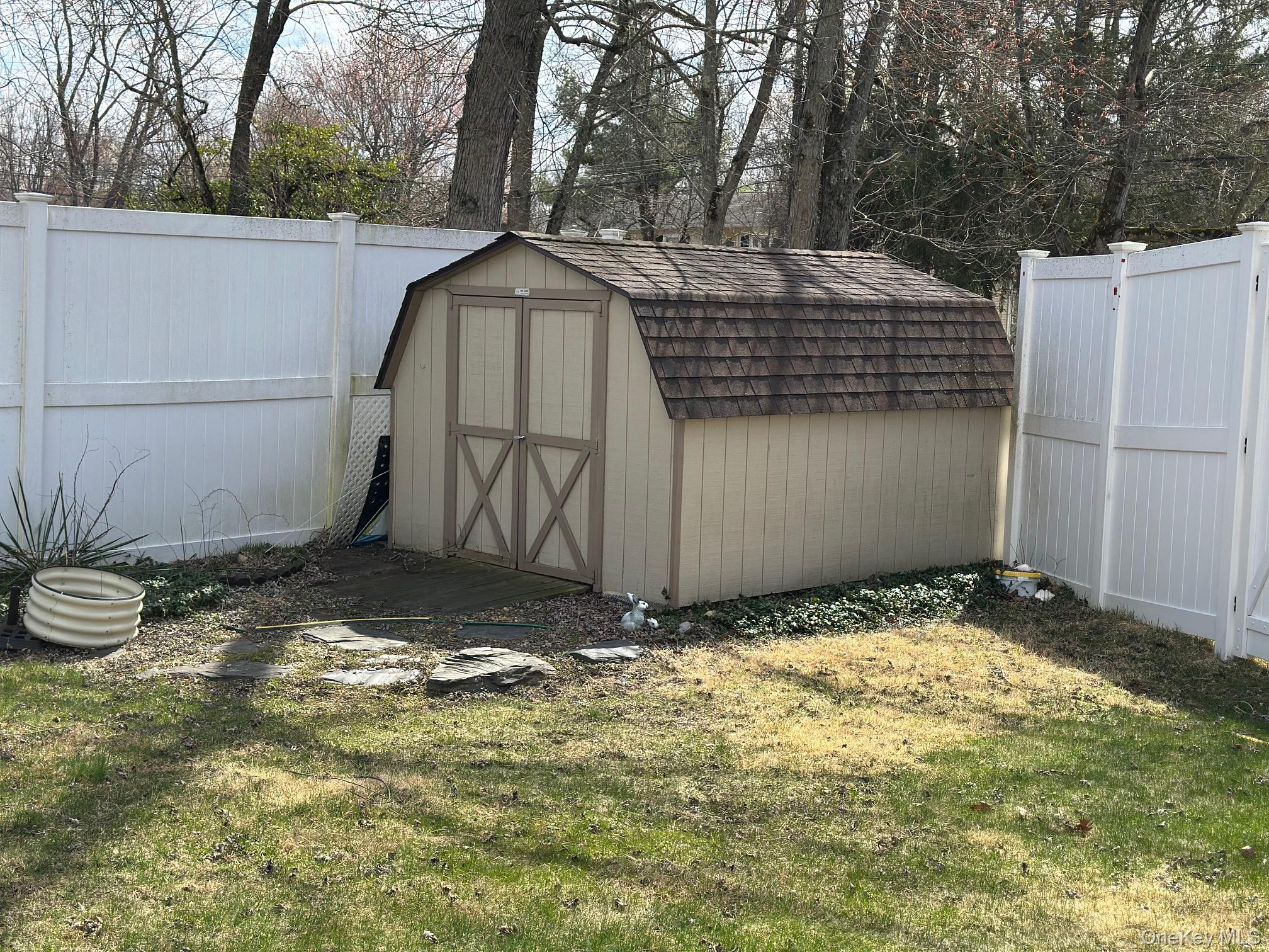 98 Sutton Park Road Poughkeepsie, NY 12603 - Photo 27 of 31 View of shed with a fenced backyard