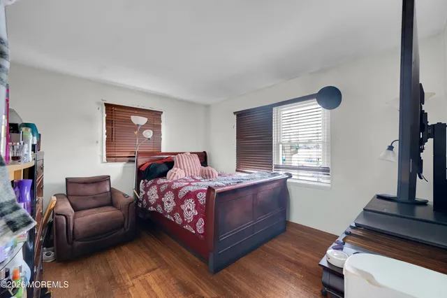 a bedroom with bed and window