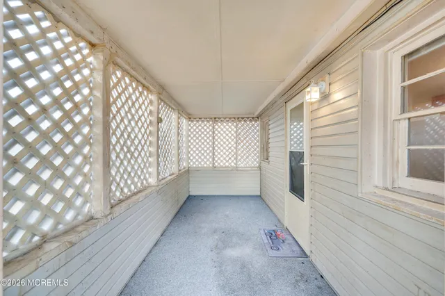a front view of house with yard and sign board
